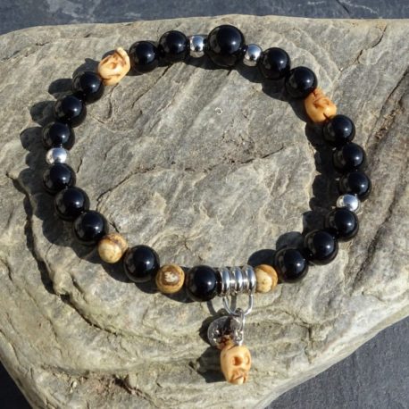 Bracelet onyx tête de mort en os et acier